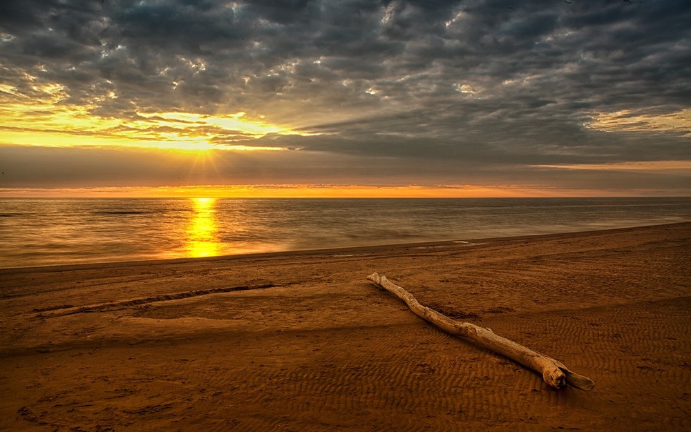 Фотографія червонным золотом потёк закат / Normund Kolberg / photographers.ua