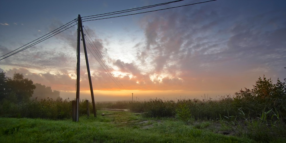 Фотографія туманний світанок і стовпи електричні / Normund Kolberg / photographers.ua